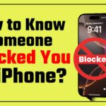 Holding iPhone with hand and the written Blocked you on iPhone