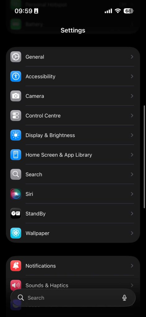 iPhone Settings app home screen showing display, accessibility, and system options.