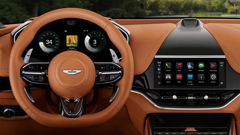 Apple CarPlay ultra displayed on luxury car dashboard with navigation music and app controls