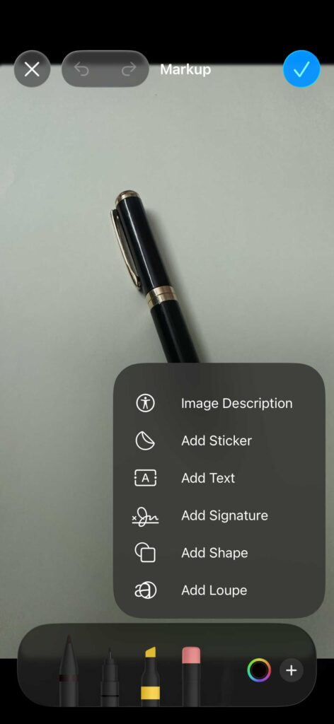 iPhone Photos app Markup menu showing options like image description, add text, and add sticker