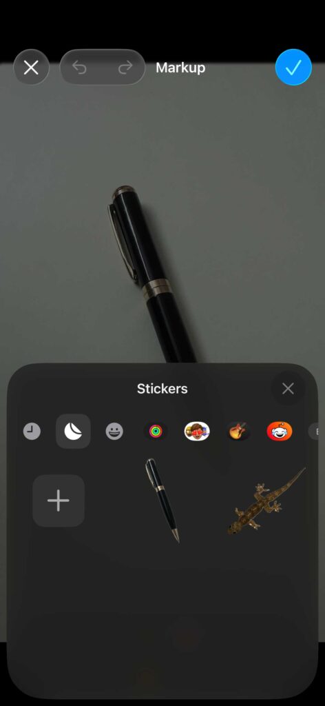 Stickers selection panel in iPhone Markup editor with custom stickers visible