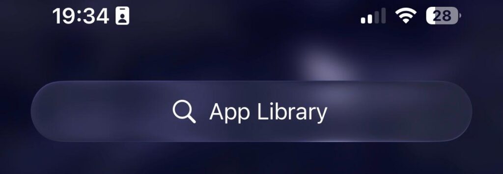 iPhone App Library screen showing how to access hidden apps