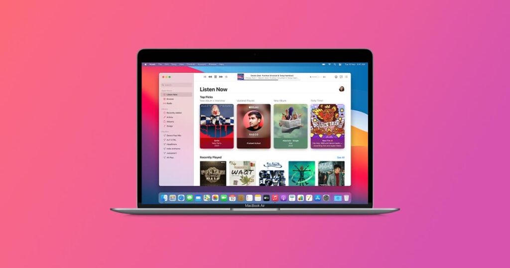 MacBook showing the iTunes music library and playlist interface