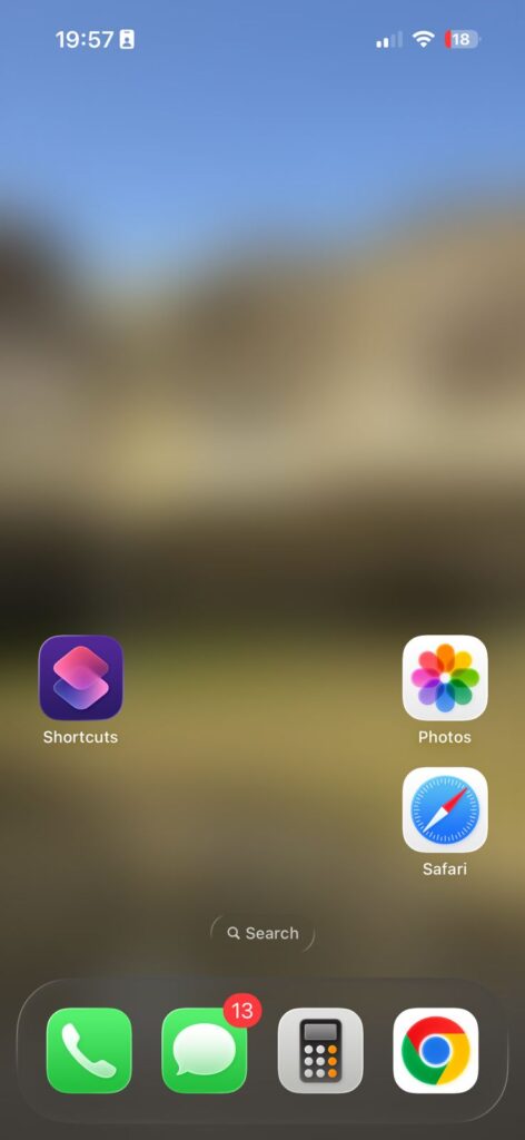 blurry wallpaper on iphone home screen with icons visible and low quality background image