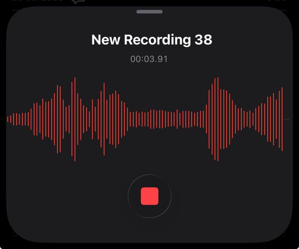 iPhone Voice Memos recording screen showing live waveform and stop button