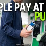 person using Apple Pay at a gas pump with iPhone