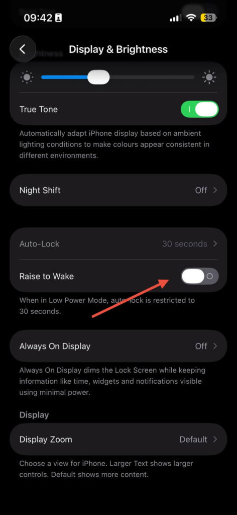 iPhone display settings showing Raise to Wake option turned off to reduce battery drain