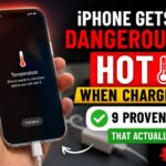 Hand holding an overheating iPhone while charging with temperature warning screen and hot charging fixes text