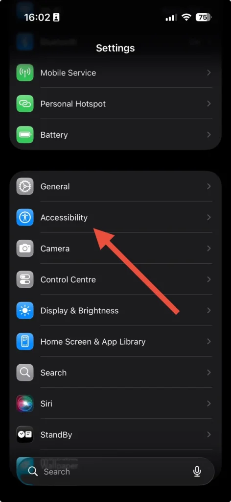 Accessibility option highlighted in iPhone Settings menu with an arrow pointing to it