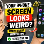 Person holding an iPhone with unusual screen colors and a message explaining how to turn off Smart Invert on iPhone