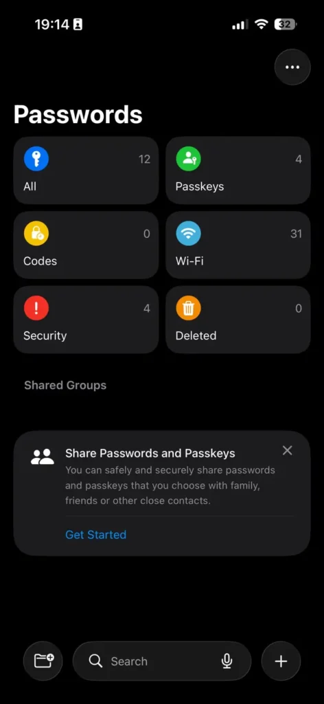 Passwords app displaying saved passwords, passkeys, Wi-Fi credentials, and shared groups on iPhone.