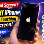 Hand holding an iPhone with a dead black screen showing how to turn off an iPhone without touching the screen in 2026.
