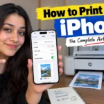 Woman holding an iPhone showing the Print menu beside a wireless printer