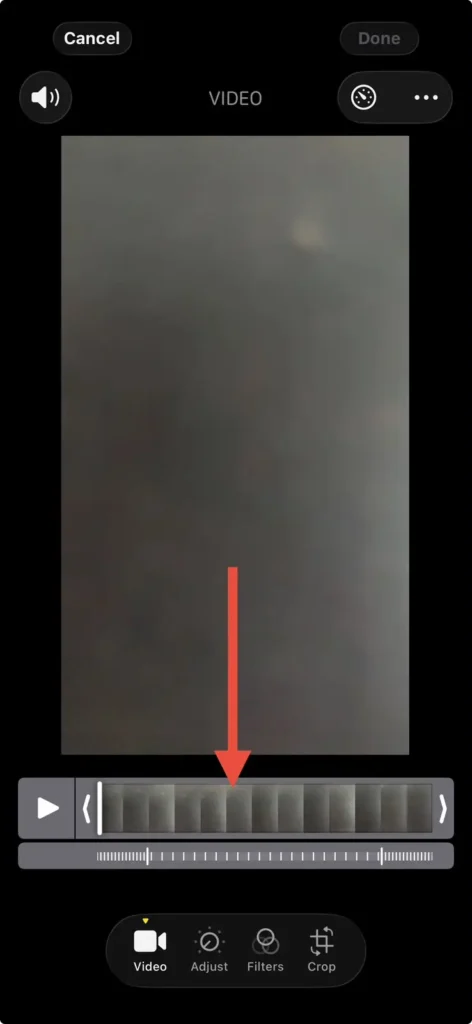 iPhone Photos video editor showing the timeline and playback controls for adjusting a video