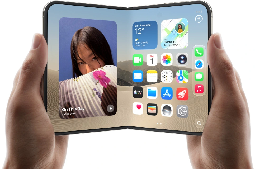 Foldable iPhone Duo concept held in two hands, showing a wide display with app icons, widgets, and a photo panel.
Copy alt text